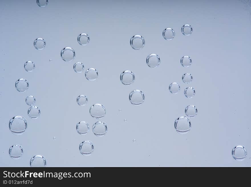 Drops of water on a blue background. Drops of water on a blue background