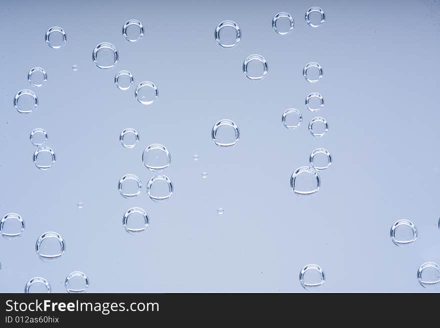 Drops of water on a blue background. Drops of water on a blue background