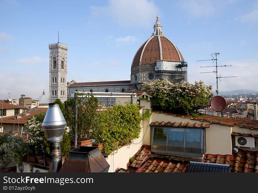 View of the Basilica di Santa Maria del Fiore, Florence, Italy (better known as the Duomo) across the roof tops