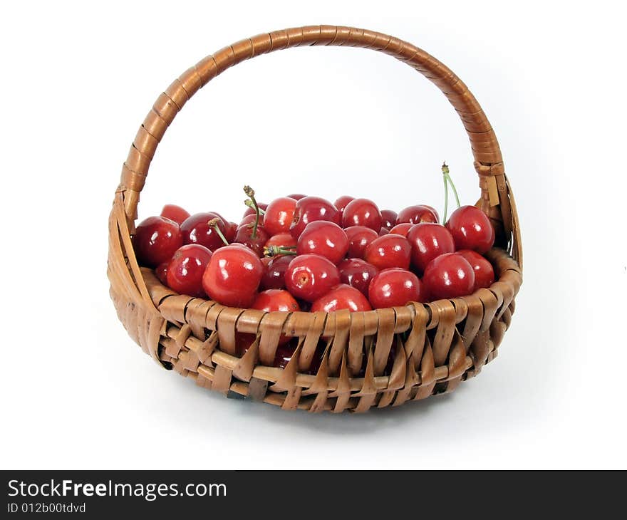 Cherries in a basket  isolated on white background.