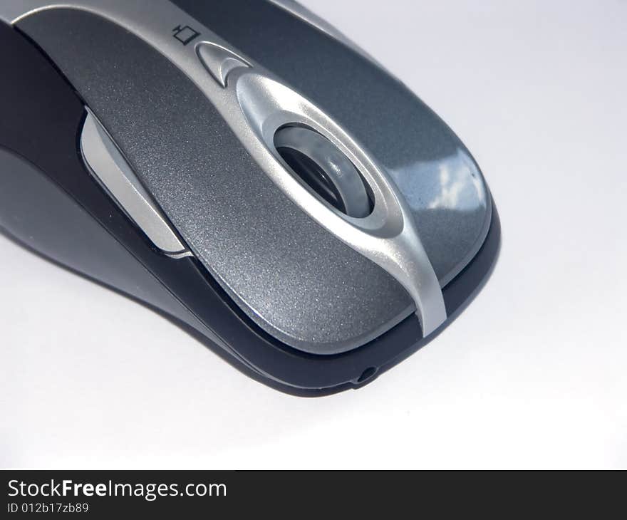 The image of the computer mouse on a homogeneous background. The image of the computer mouse on a homogeneous background