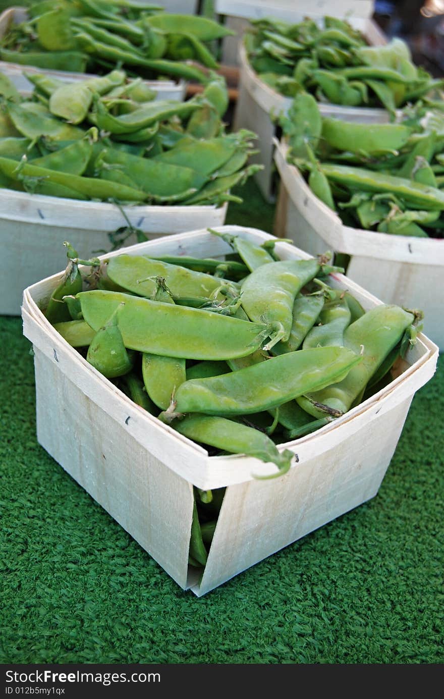 Sugar peas in  boxes at the market. Sugar peas in  boxes at the market.