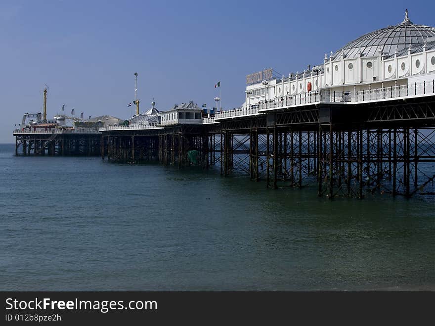 Looking down brighton pier on hot summers day