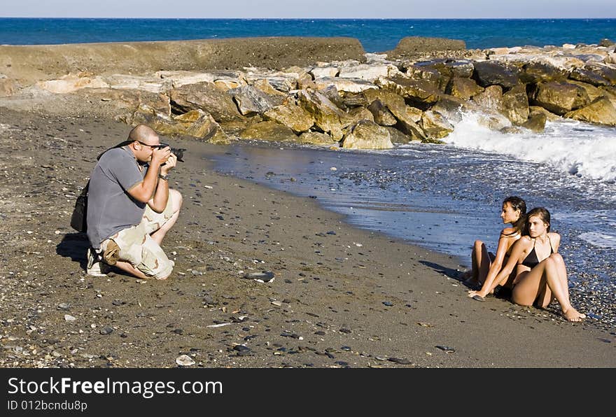 Photographer and models in summer photoshooting