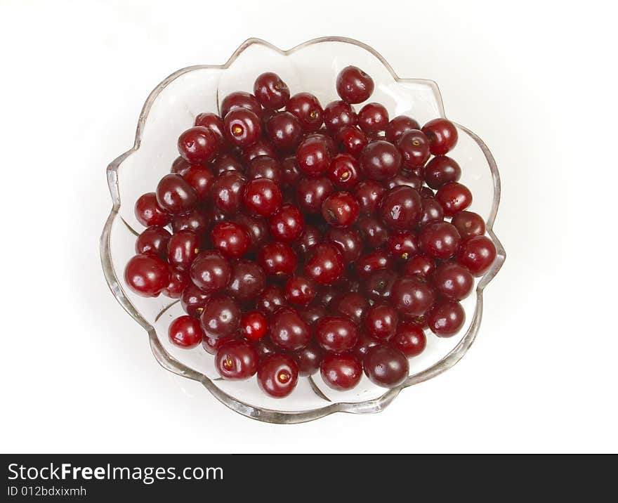 Sweet cherries on white ground