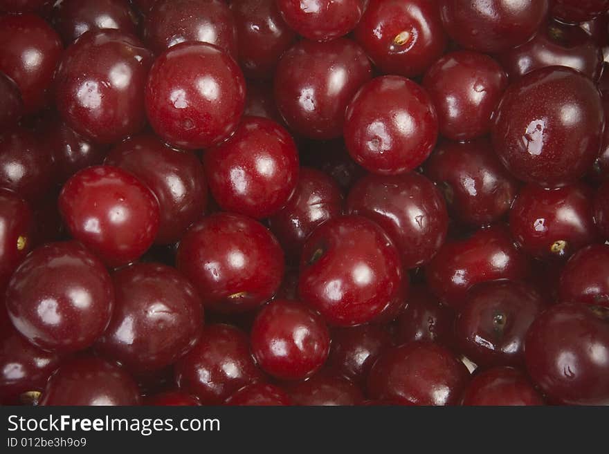 Sweet red cherries in pot. Sweet red cherries in pot