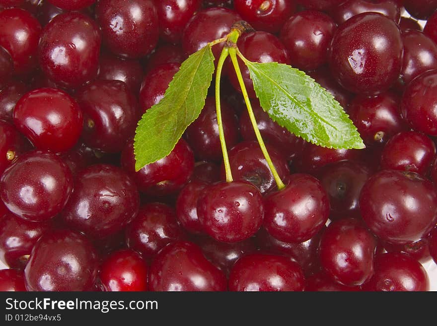 Sweet red cherries in pot. Sweet red cherries in pot