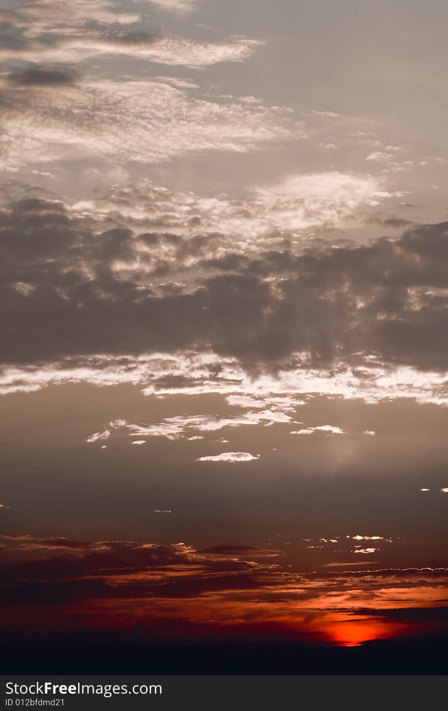 Dramatic red with silver sunset over the sea. Dramatic red with silver sunset over the sea