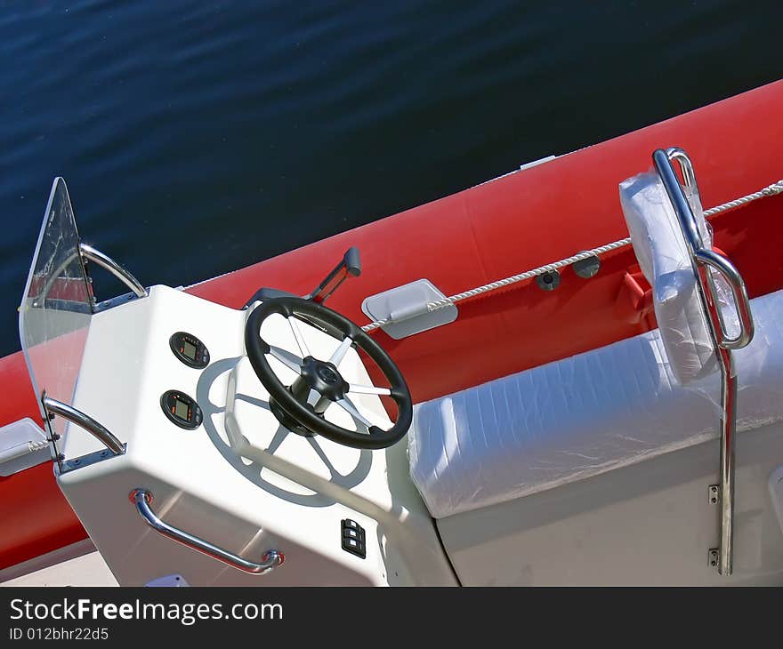 New motor boat wheel and control panel close up. New motor boat wheel and control panel close up.