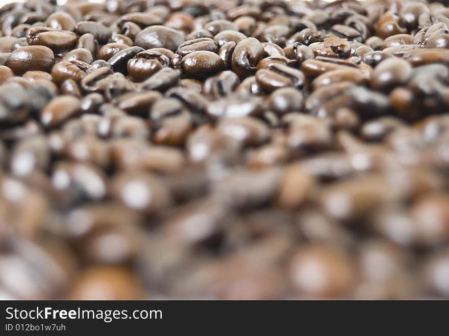 Closeup shot of coffee beans filling frame; selective focus