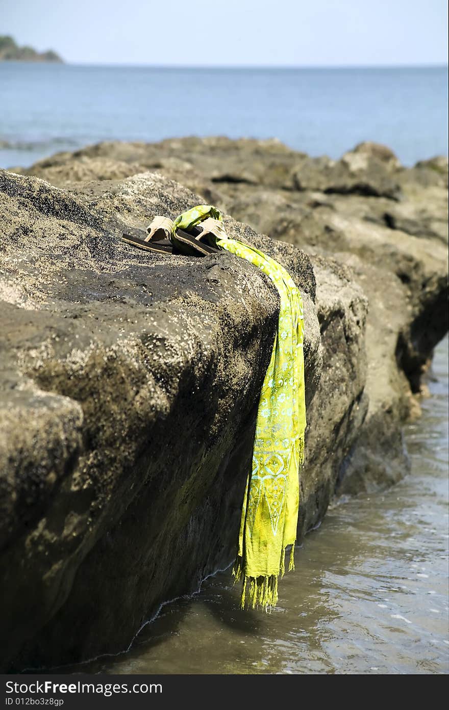 Sandals by the shore