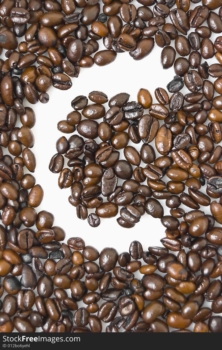 Shot of coffee beans framing letter C