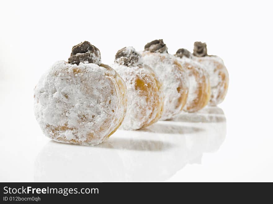 A line of temptingly delicious strawberry-filled donuts