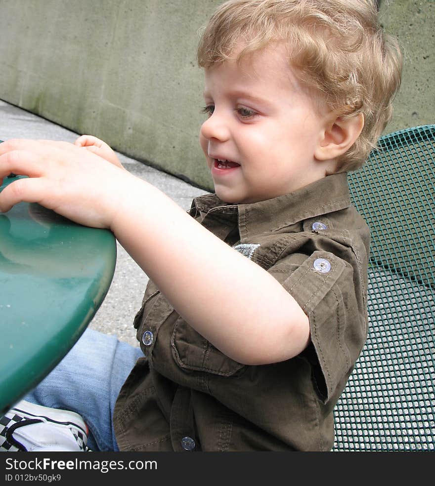 A young boy sitting at the table. A young boy sitting at the table