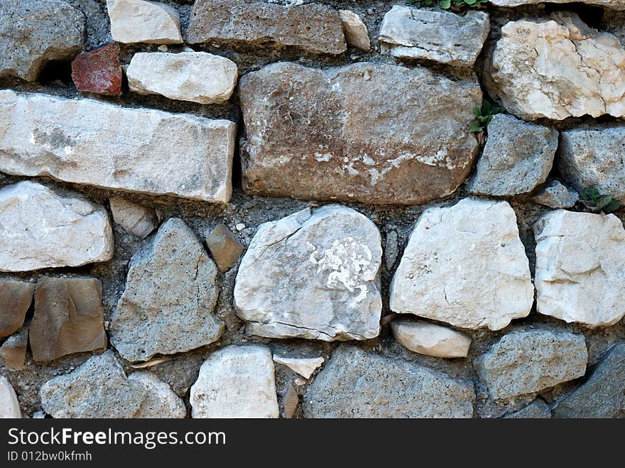 Stone wall made from big stones and rocks