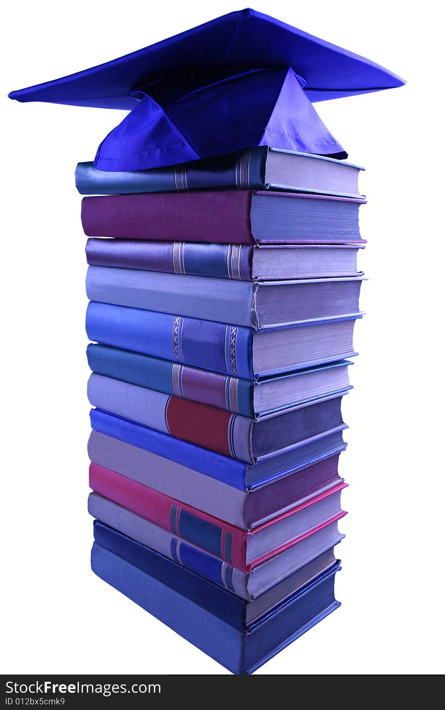 Blue Graduation cap on top of book pile