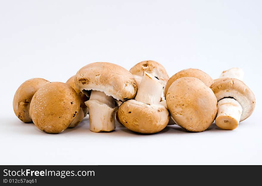 Still life of a handful of swiss brown button mushrooms