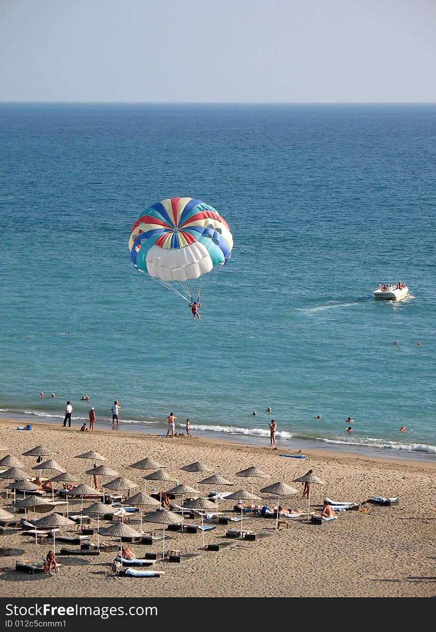 Flying with parachute above the sea. Flying with parachute above the sea