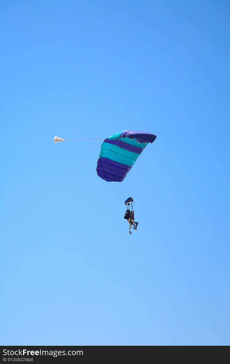 Paraglider with a couple flying at the blue sky of Canary Islands spain. Paraglider with a couple flying at the blue sky of Canary Islands spain