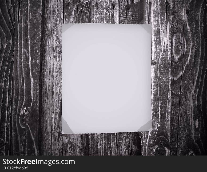 Blank paper on old wooden background