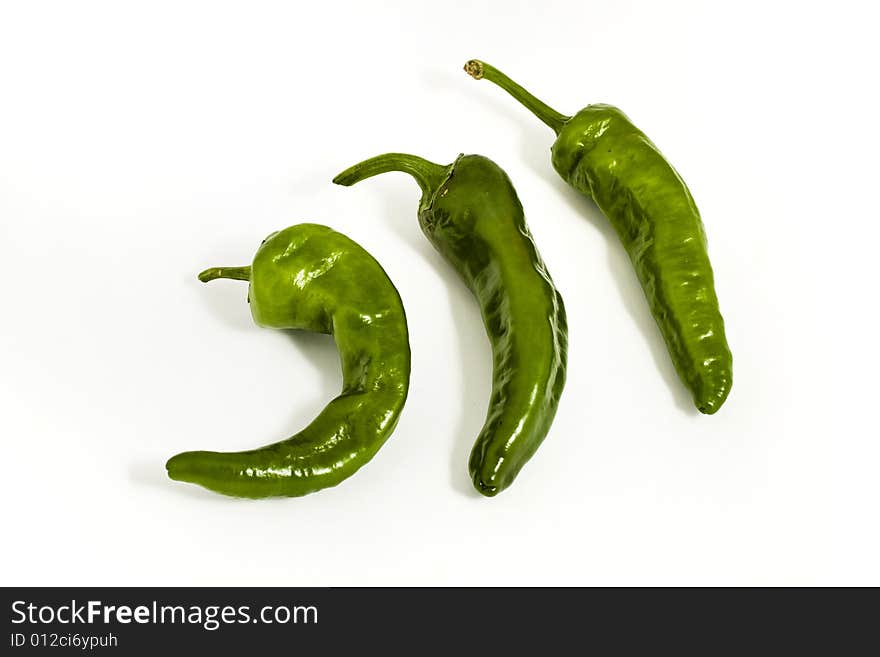 Three green peppers isolated on white background. Three green peppers isolated on white background