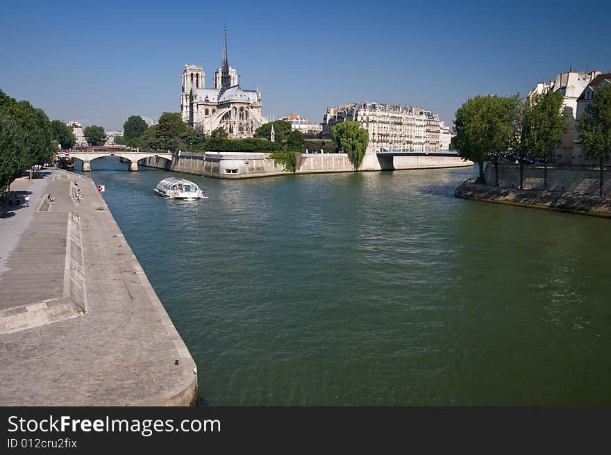 Riverside embankment on the river Seine in Paris on a summers day. Riverside embankment on the river Seine in Paris on a summers day.