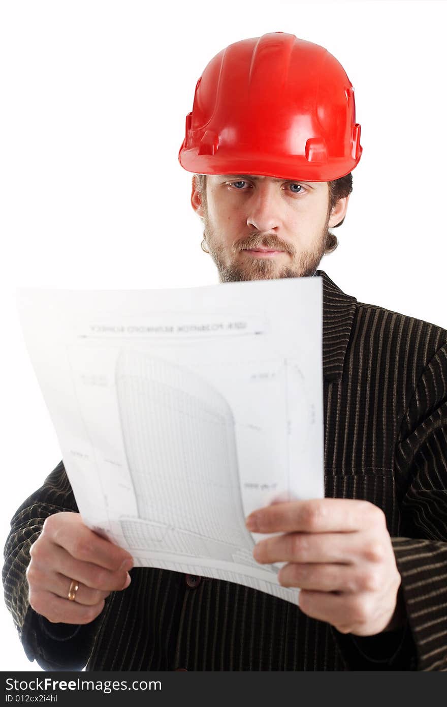 Construction foreman in red helmet checking drawings