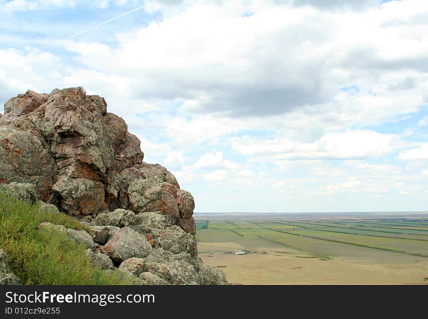 Close up of rock on background of beautiful landscape. Close up of rock on background of beautiful landscape