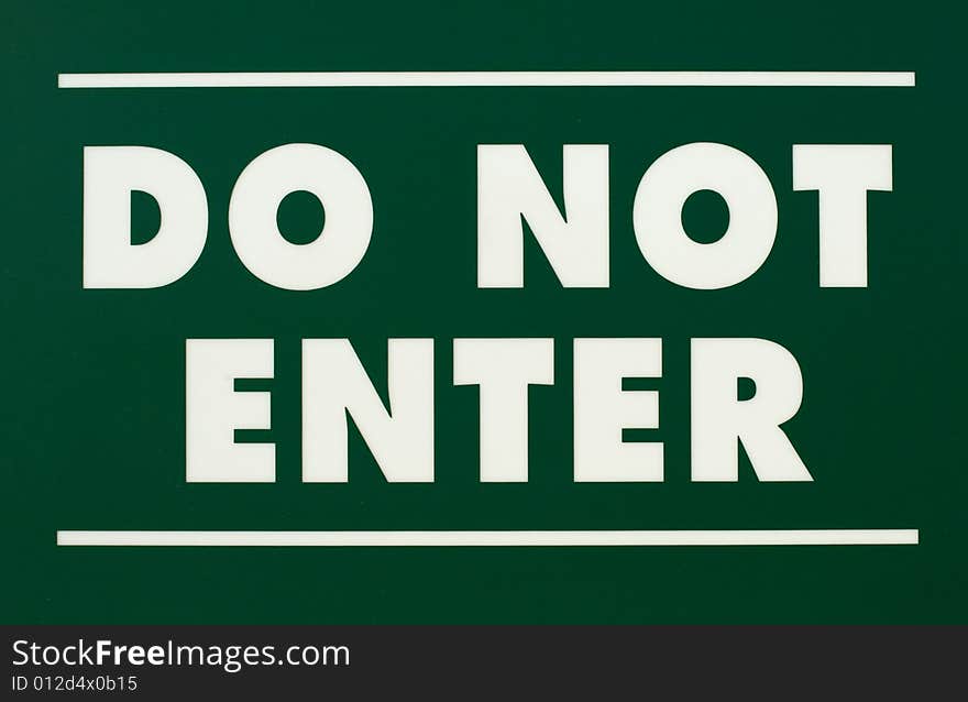 A green and white do not enter sign.