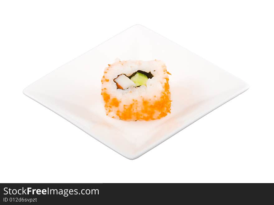 A square white plate with a piece of sushi