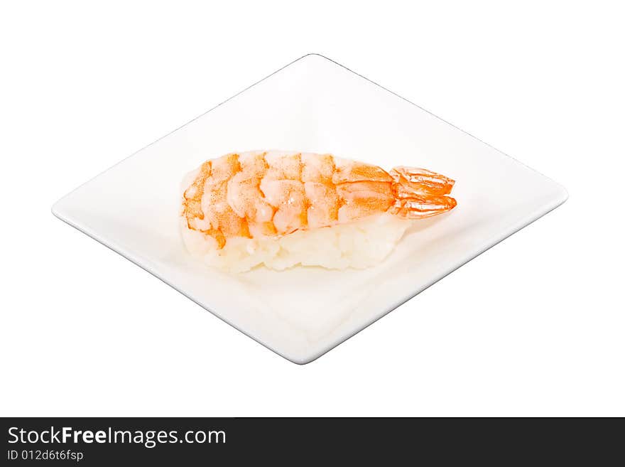 A square white plate with a piece of sushi