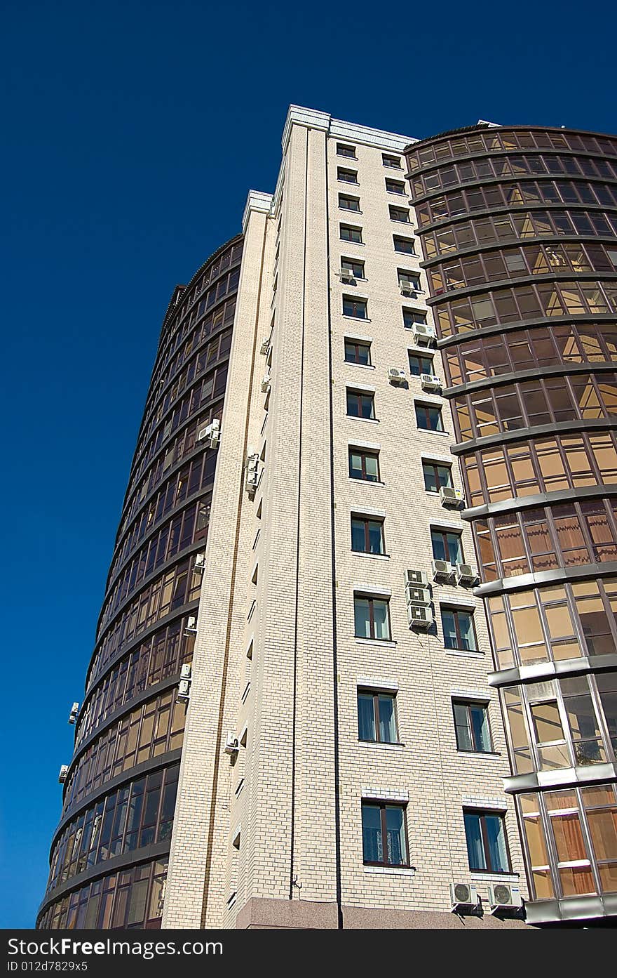 High modern office building with blue sky background