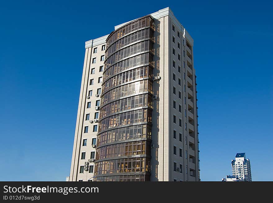 High modern buildings on blue sky - close and far away. High modern buildings on blue sky - close and far away