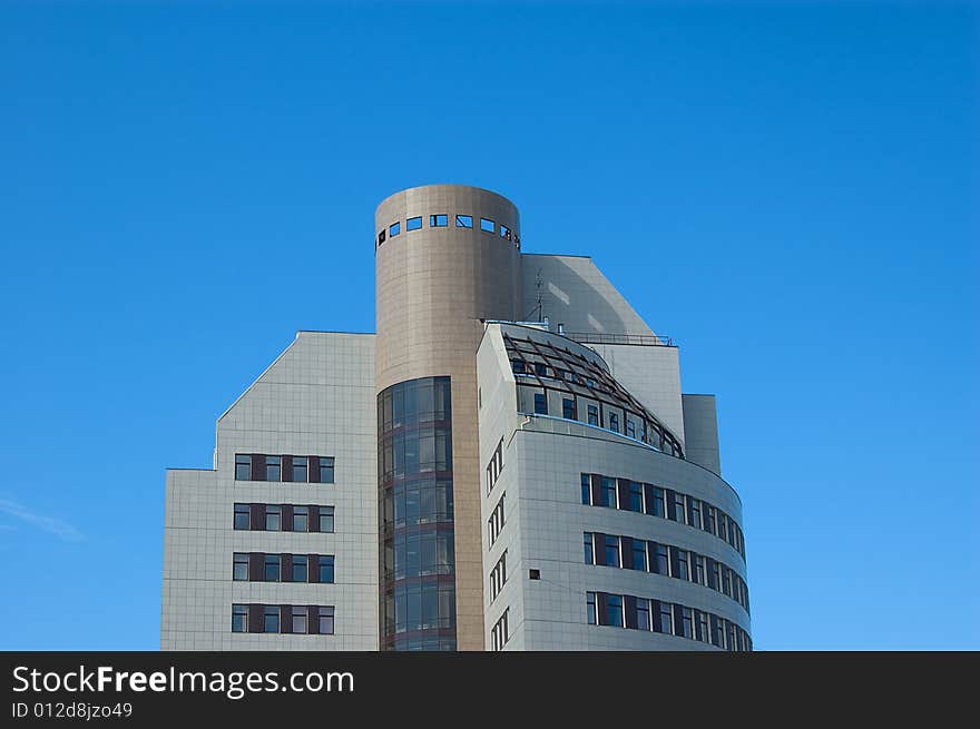 High modern office building with blue sky background