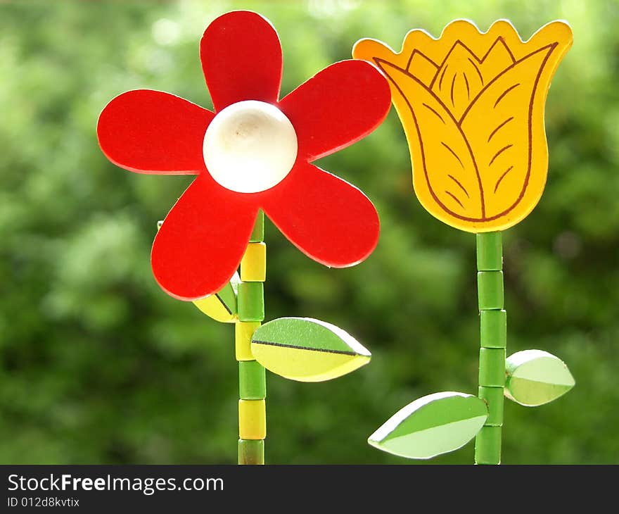 Red and yellow flower on the green backgound. Red and yellow flower on the green backgound