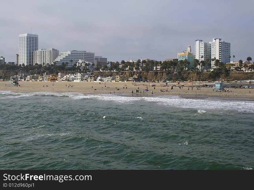 Waves coming ashore on sunny afternoon at Santa Monica Beach in California. Waves coming ashore on sunny afternoon at Santa Monica Beach in California.