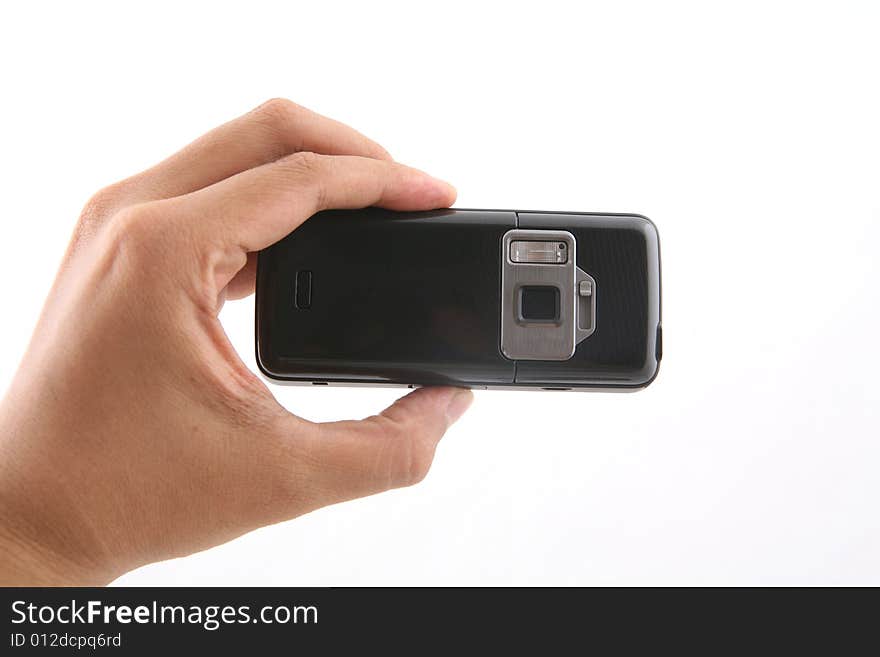 A man is holding a black cameraphone shot over white background. A man is holding a black cameraphone shot over white background