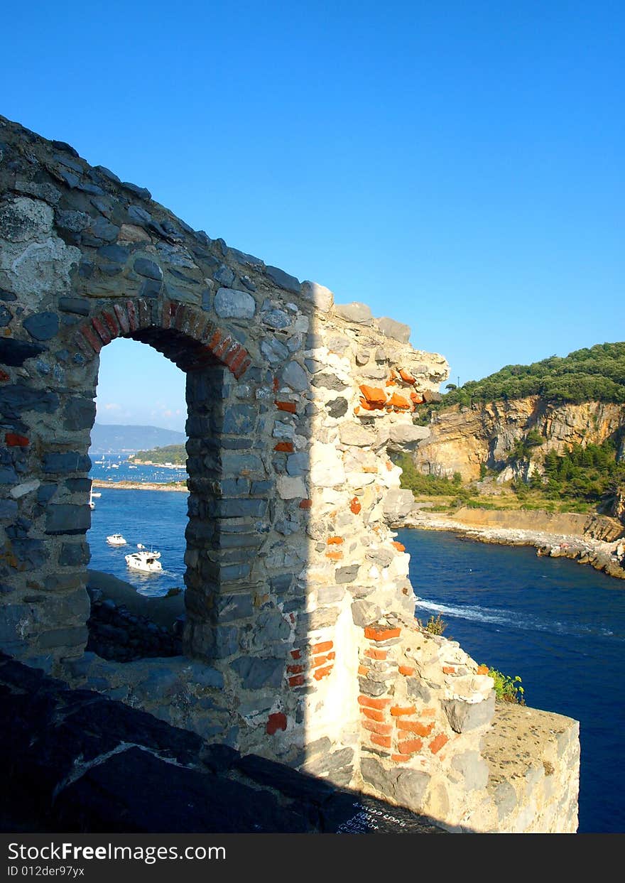 A detail of an ancient open window in the San Pietro church's balcony in Porto Venere. A detail of an ancient open window in the San Pietro church's balcony in Porto Venere