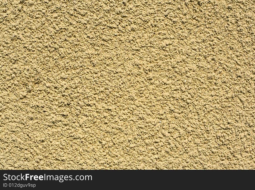 Fragment of the plastered wall, abstract background. Fragment of the plastered wall, abstract background