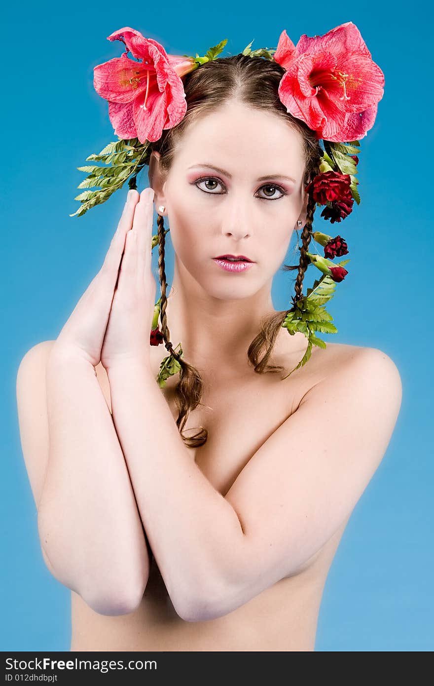 Young woman with big flowers in her hair. Young woman with big flowers in her hair