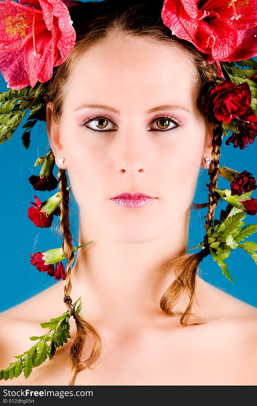 Young woman with big flowers in her hair. Young woman with big flowers in her hair