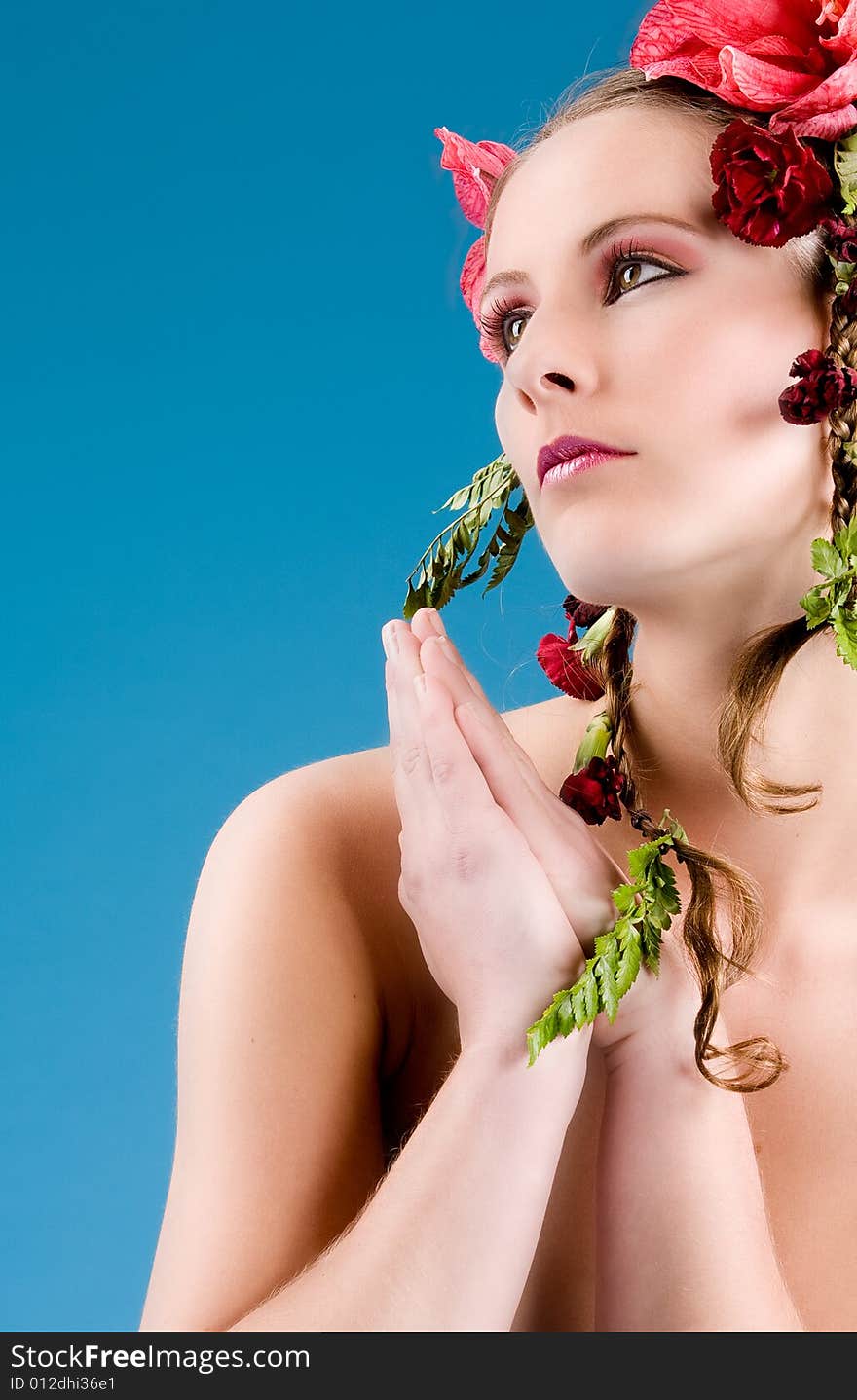 Young woman with big flowers in her hair. Young woman with big flowers in her hair