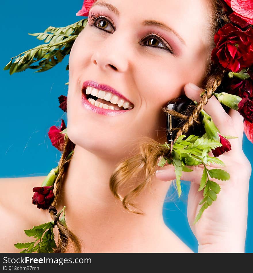 Young woman with big flowers in her hair. Young woman with big flowers in her hair