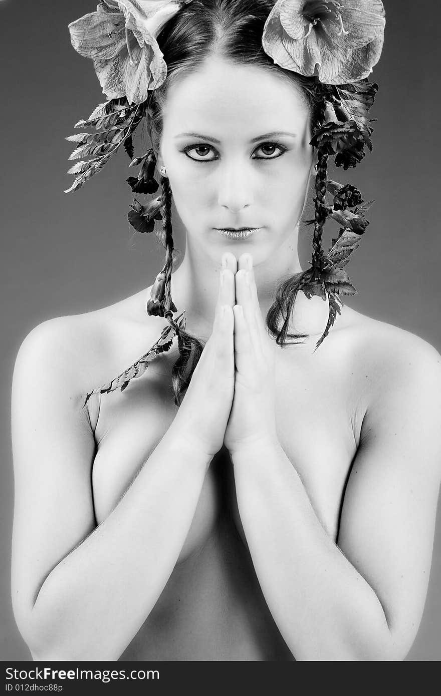 Young woman with big flowers in her hair. Young woman with big flowers in her hair