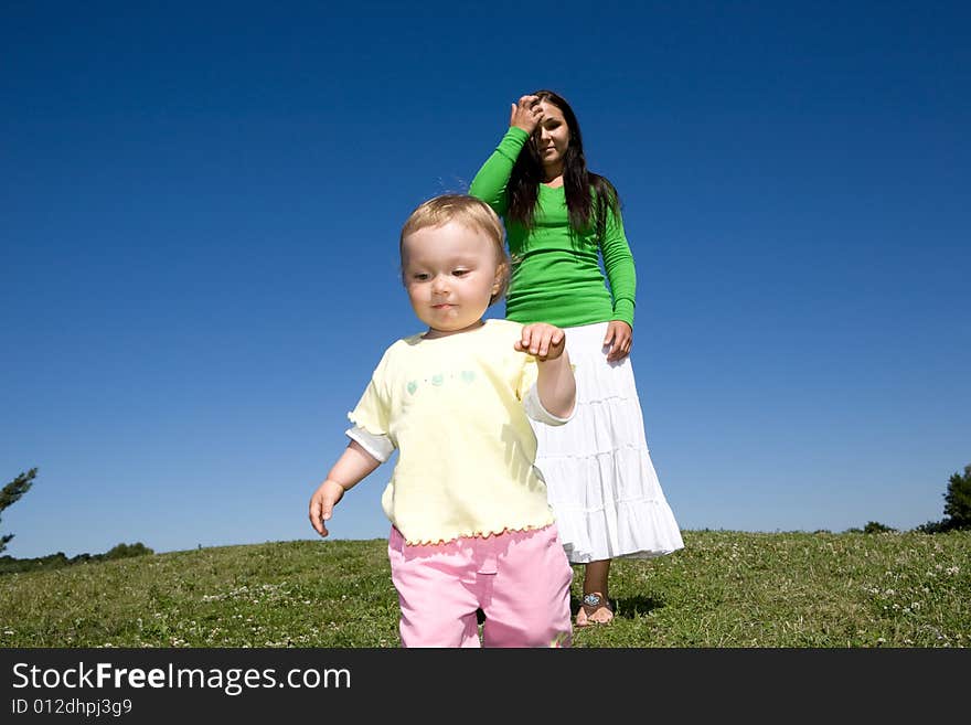 Active family on green meadow. Active family on green meadow