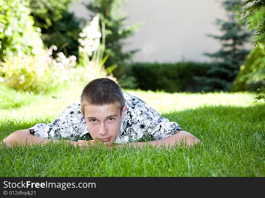 Happy boy lying on grass. Happy boy lying on grass