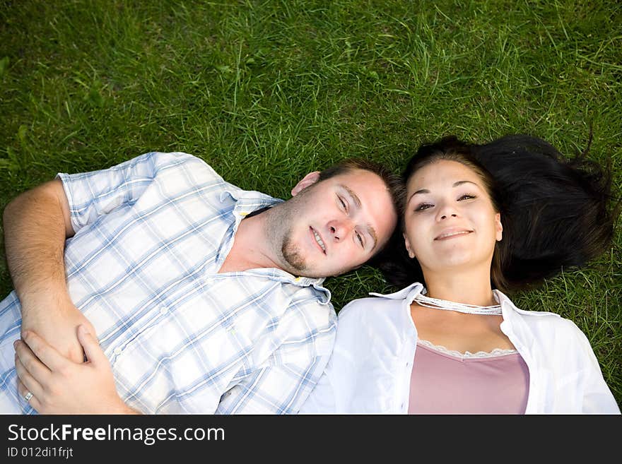 Happy couple lying on grass. Happy couple lying on grass