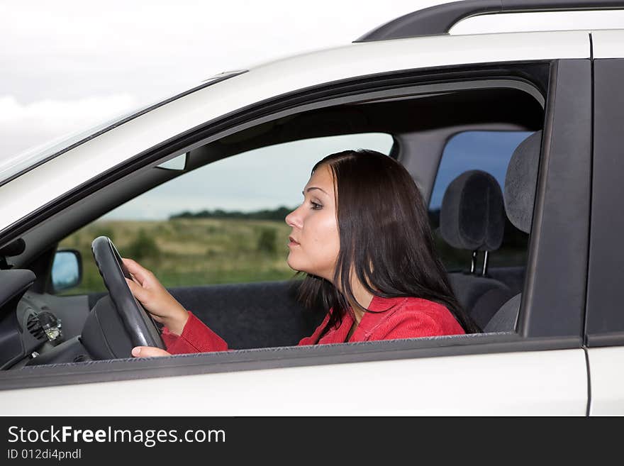 Attractive brunette woman traveling by car. Attractive brunette woman traveling by car