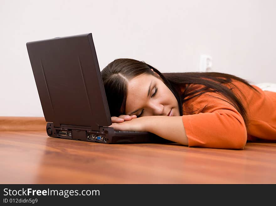 Casual woman lying on flor with laptop. Casual woman lying on flor with laptop