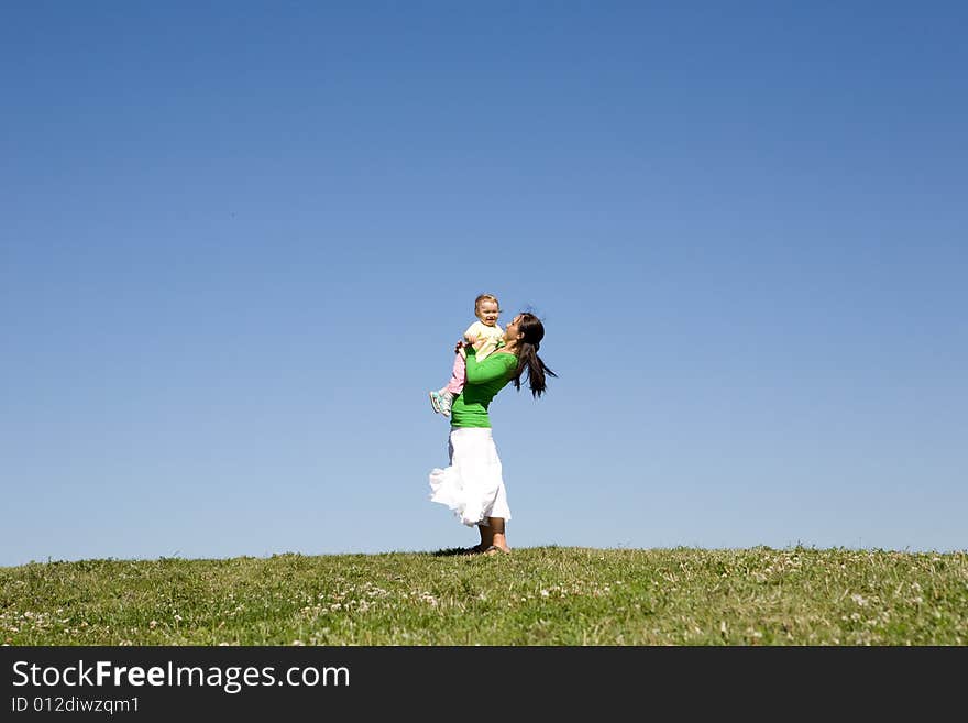 Active family on green meadow. Active family on green meadow